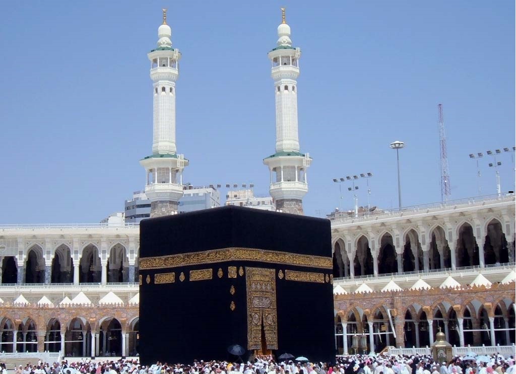 The Kaaba surrounded by pilgrims in the courtyard of Masjid al-Haram